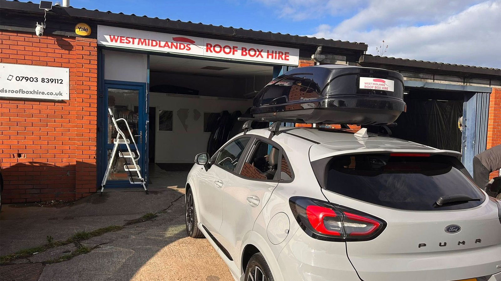 Customer vehicle with roof box and roof bars fitted at Tamworth